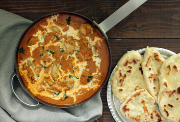 Butter chicken served with Homemade Indian Naan Bread 