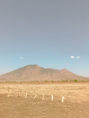 Serengeti Landscape  Vast Plains, Majestic Mountain, and a Silent Sky