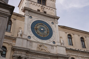 astronomical clock adorns the facade of a historic building