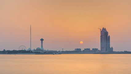 Obraz premium Sunset in Abu Dhabi over Marina Island timelapse