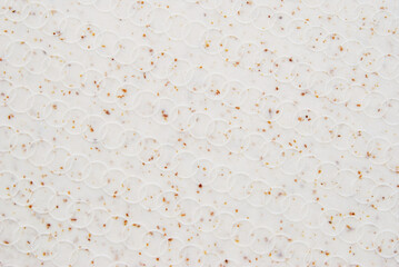 Beige grain circle embossed texture as background