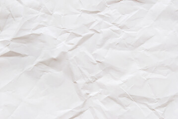 A sheet of white wrinkled glossy paper texture as background