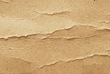 Brown grunge recycled wrinkled paper with ripped edges