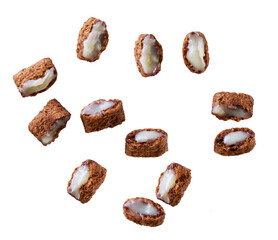 Broken chocolate pillows with milk cream isolated on white background.
