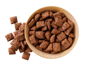 chocolate pillows pouring out of wooden bowl isolated on white background. Top view.