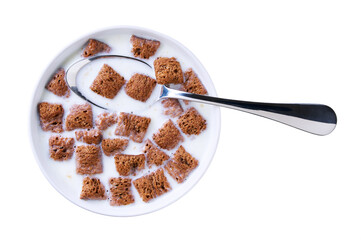 bowl with chocolate pillows with milk isolated on white background. Top view.
