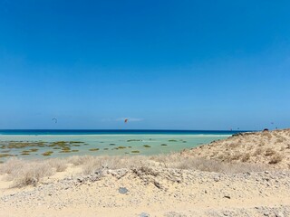Turquoise ocean water and white sand in Sotavento beach of Fuerteventura, Canary Islands, Spain