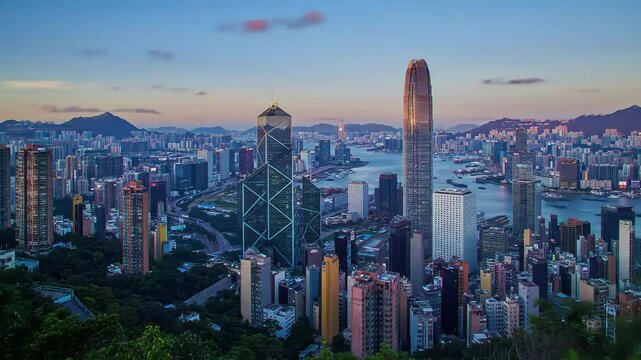 Aerial view of Hong Kong cityscape showing skyscraper,  Time-lapse day time into night