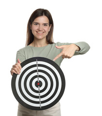 Targeting. Smiling woman pointing at dart board on white background