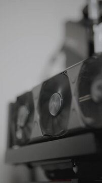 PC GPU graphic card operating inside a computer, spinning fans. Vertical Footage 4K