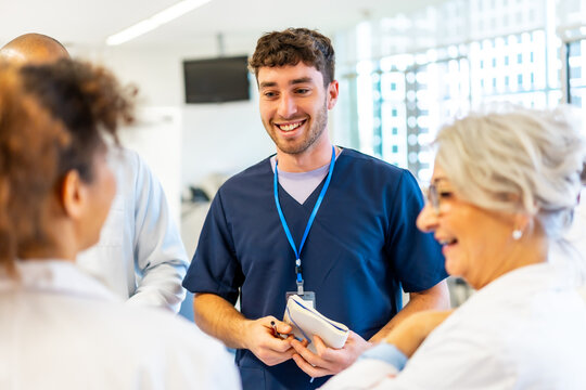 Medical team discussing patient care in hospital corridor