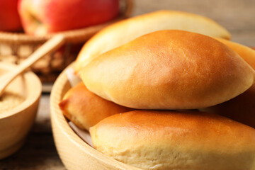 Tasty baked patties on wooden table, closeup