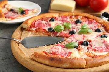Tasty pizza served on grey table, closeup