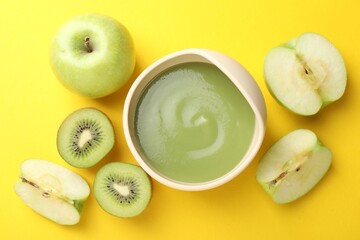 Baby food. Tasty puree in bowls and different ingredients on yellow background, flat lay