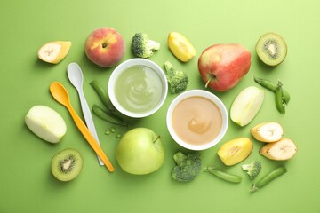 Baby food. Tasty puree in bowls and ingredients on green background, flat lay