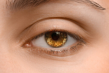 Obraz premium Woman with fire burning in her eye, closeup
