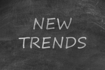 Obraz premium New Trends words written on black chalkboard