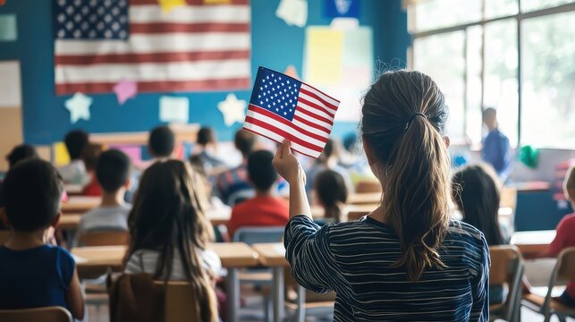 Student raises american flag in classroom: patriotism and education in us schools.  a diverse group of children learn together, showcasing inclusivity and national pride.