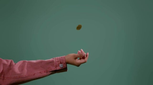 4K Ultra HD Slow Motion Video of Coin Flipping in the Air &ndash; Decision Making, Chance, and Luck Concept