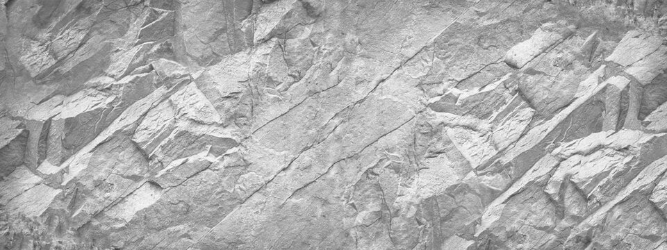 Black white light gray stone granite texture background. Rock surface mountain texture. Close-up. Business industry construction. Wide banner. Panoramic. Design.