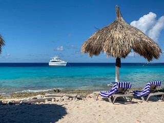 Private yacht floating off the shore of Klein Curaçao with white sand and turquoise water