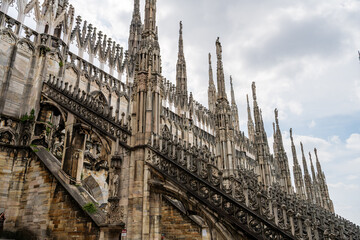 Milan, Italy Gothic cathedral spires architecture detail in urban setting, Milan Duomo Cathedral.