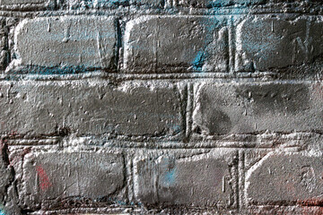 Texture of a brick wall painted in silver color