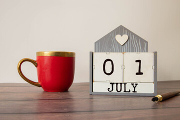 July 1st. Image of july 1 wooden color calendar on white background.
