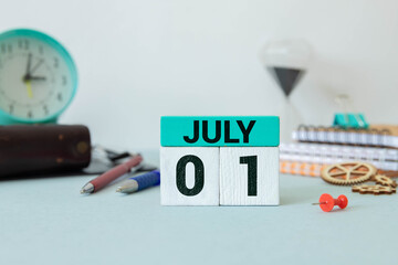 July 1st. Image of july 1 wooden color calendar on white background.
