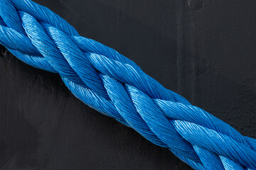mooring tie ships at the dock thick twisted marine rope is shown in close-up detail