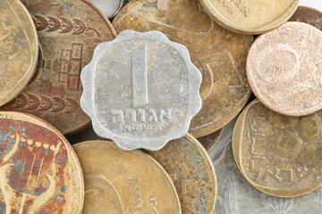 The old Israeli shekel currency before being replaced. The 1 agora coin is copper aluminium nickel.