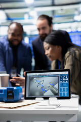 Diverse group of consultants engineers conducting inspection on solar panel performance, combining...