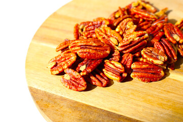 Delicious salted pecan nuts scattered.