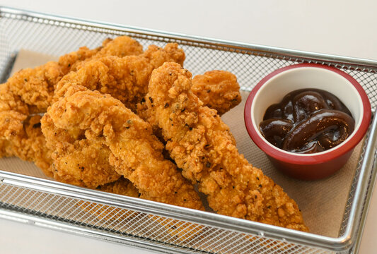 Fried chicken fingers with barbaque sauce 