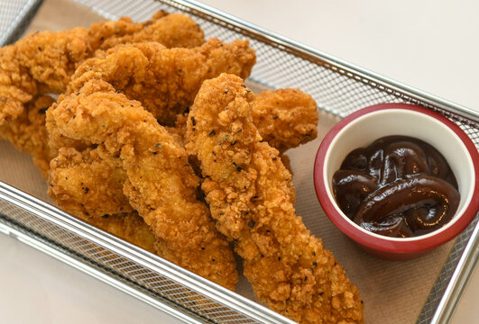 Fried chicken fingers with barbaque sauce 