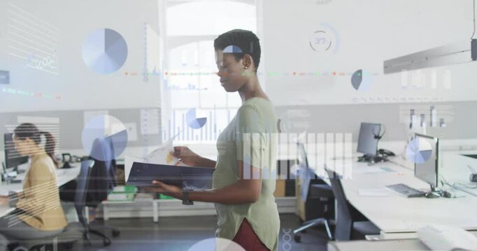 Office employee entering business space, carrying binder and analyzing charts with digital overlays