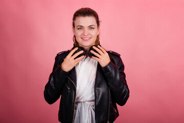 Woman with headphones, listening to music, fashion model in studio posing, music genre, smiling,...