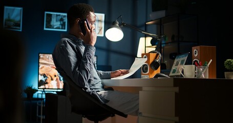 Male freelancer calling financial expert at home to discuss about monthly funds balance, increase...