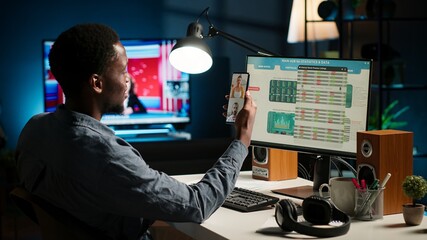 Black economist on video conference chat with consultants analyze earnings balance and tracking financial fluctuation for a potential growth. Specialist debating with his associates. Camera B.