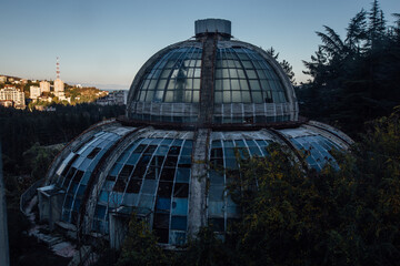 Fototapeta premium Dome of old abandoned greenhouse winter garden