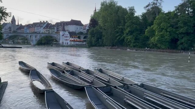 Boats wading on the Rois River in Switzerland . Boats on the river in the evening 