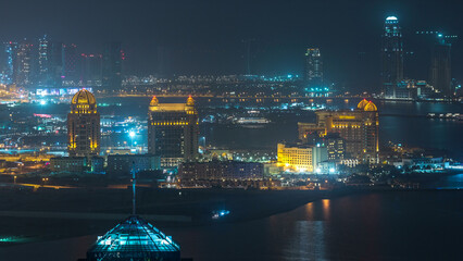 Fototapeta premium Aerial night view to Pearl-Qatar timelapse from top.