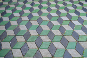 Interlocking Paver Blocks - Hexagon 3D Paver Blocks. The paving tiles of gray, black and green are lined with a geometric pattern. Background and texture
