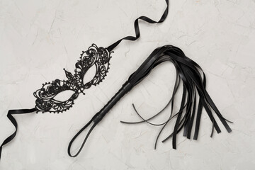 Set of erotic BDSM accessories on concrete background, top view