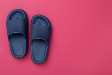 Blue sandals on color background,top view