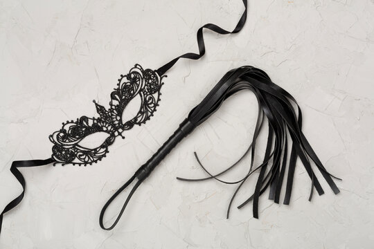 Set of erotic BDSM accessories on concrete background, top view