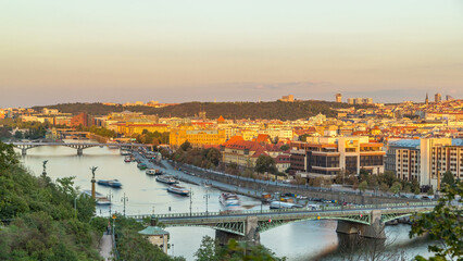 Fototapeta premium Aerial sunset view of the Vltava River and bridges evening timelapse, Prague
