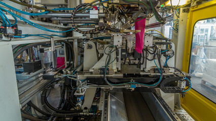 A factory for plastic canister production timelapse hyperlapse. The conveyor in the factory.