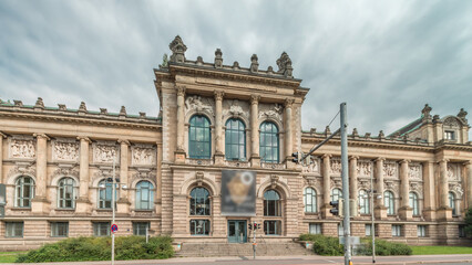 Hyperlapse of Hanover's Lower Saxony State Museum with passing traffic and people in front of its historic facade. Germany