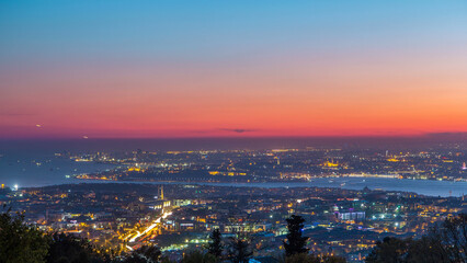 Obraz premium Istanbul classical night skyline scenery day to night timelapse, view over Bosporus channel.